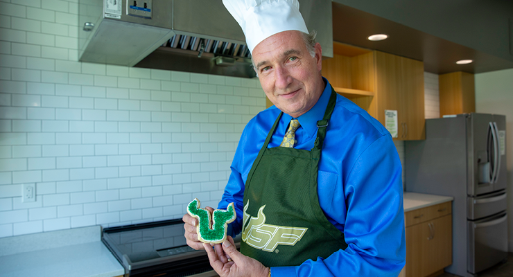 Dean Besterfield poses with a finished Bull U cookie