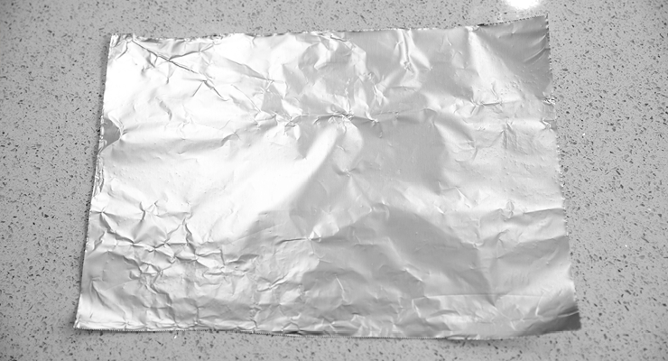 A sheet of foil laying flat on the counter