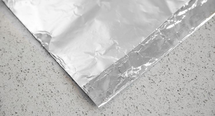 Closeup of a sheet of foil with an edge folded