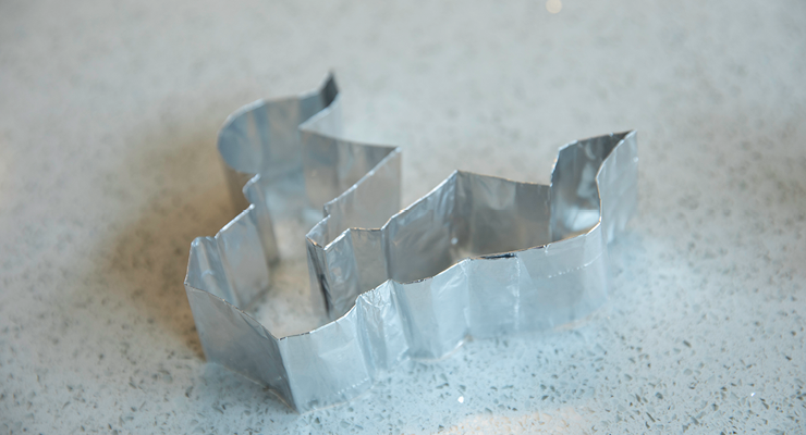 Closeup image of the Bull U cookie cutter laying on the counter