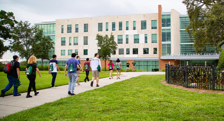 Group of students on a USF campus tour for their college orientation.