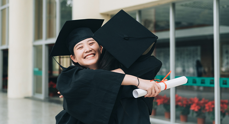 High School graduates congratulate each other