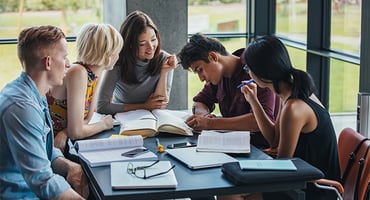 A group of close-knit honors college students studying.