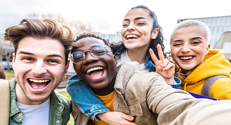 Four USF students taking a selfie.
