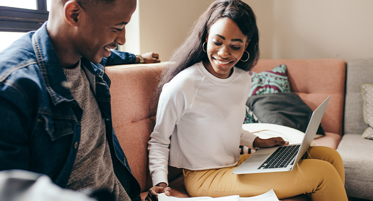 A male and female transfer student completing course work.