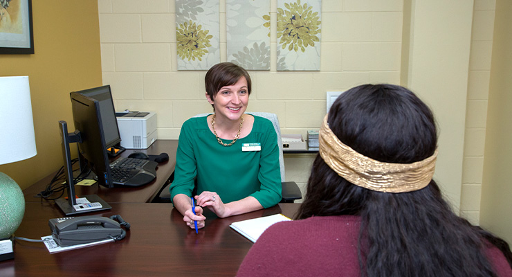 An advisor helping out a student.