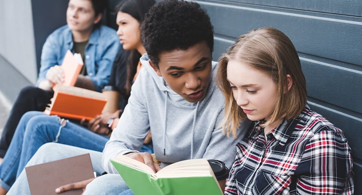 A group of young teens discussing the books they've been reading.