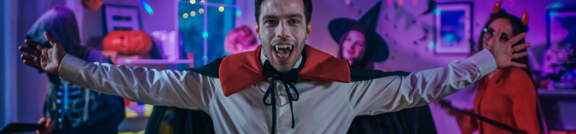 A college student dressed as a vampire for Halloween.