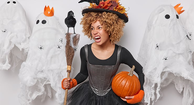 A college student dressed up as a witch.