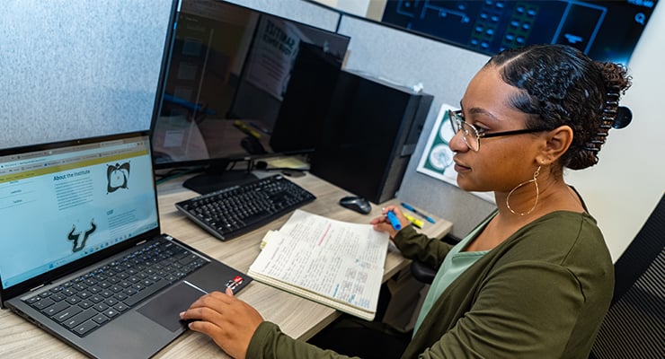 An intern doing research at her job.
