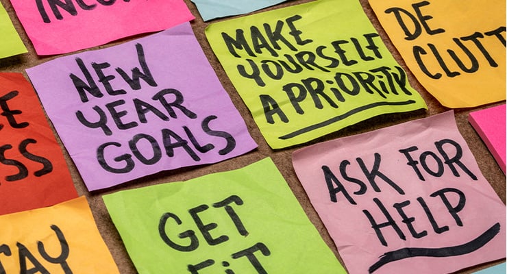 Collection of New Year's resolutions on sticky notes.