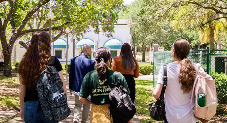 USF students taking a walk on campus.