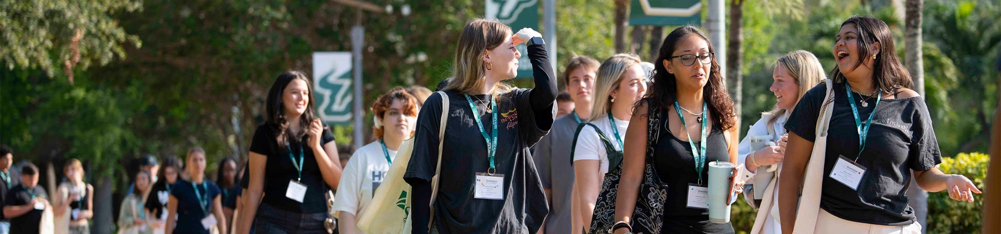USF students walking on campus during orientation. USF students walking on campus during orientation.