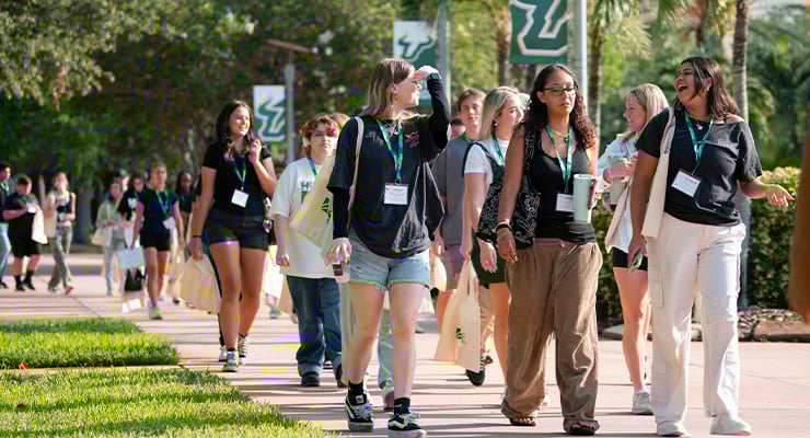 USF students walking on campus during orientation.