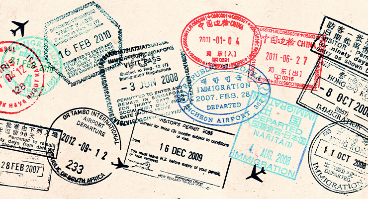 Passport stamps on a page.