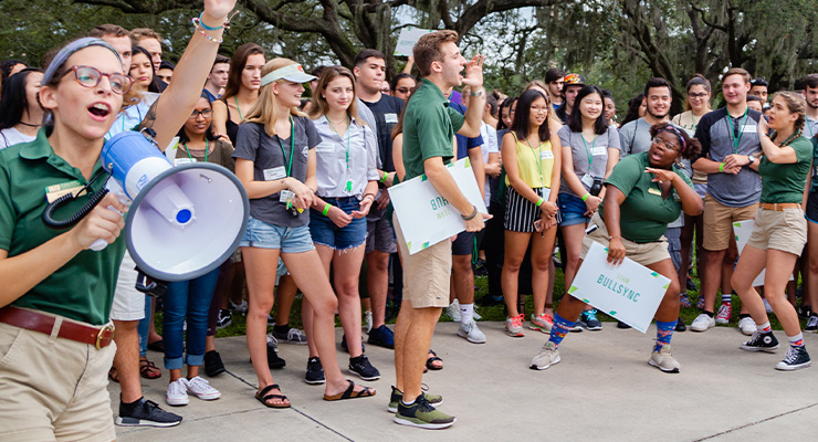 Orientation leaders and students having fun on campus.