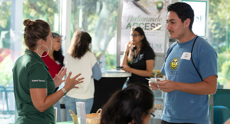 A student talking to an orientation leader.