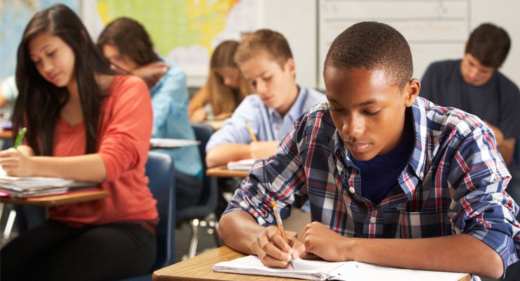 High school students working on homework at school.