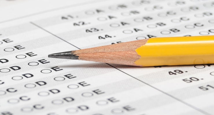Pencil sitting on a multiple choice test sheet.