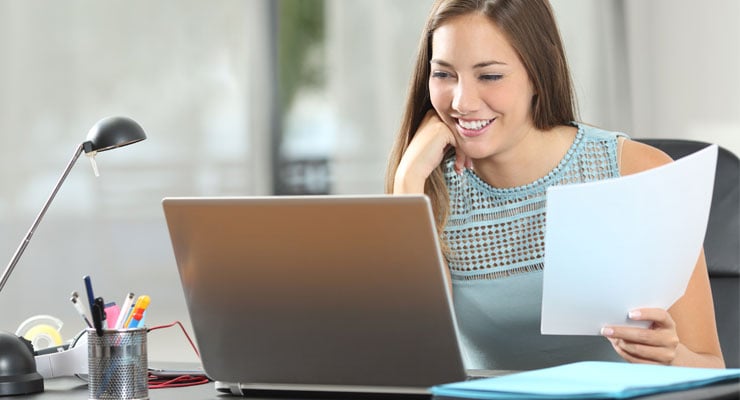 Student on the computer accepting her award offer.