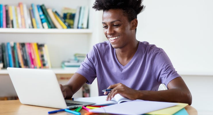 male student manages time effectively by attending class in a dedicated study room