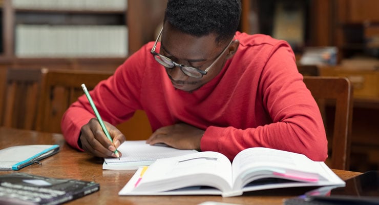 A student getting ready for college by brushing up on his academic skills.