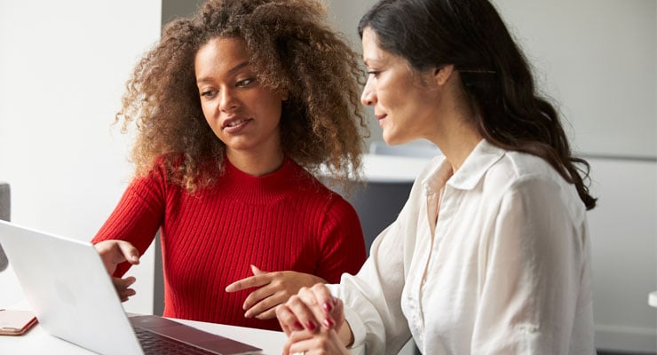 College counselor working with a high school student