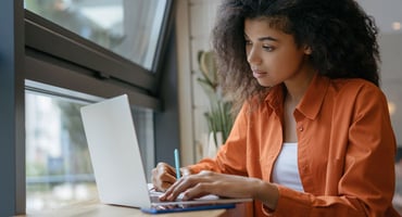 A high school student completes her college admission application