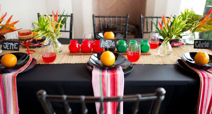 A colorful dining room table set for a Kwanzaa celebration