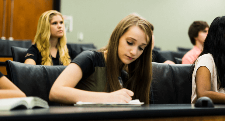 Students listening and taking notes