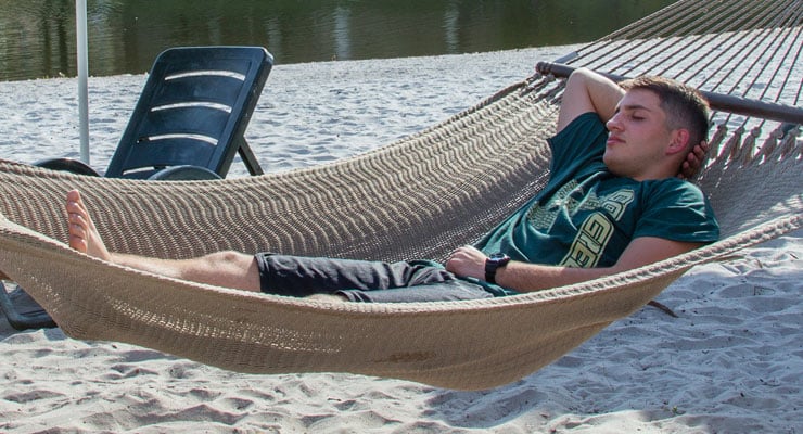 USF student taking a nap in a hammock.