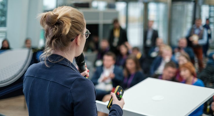 Female student leader leading a campus meeting.