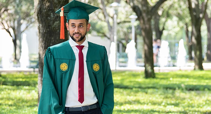 Male USF student graduating.