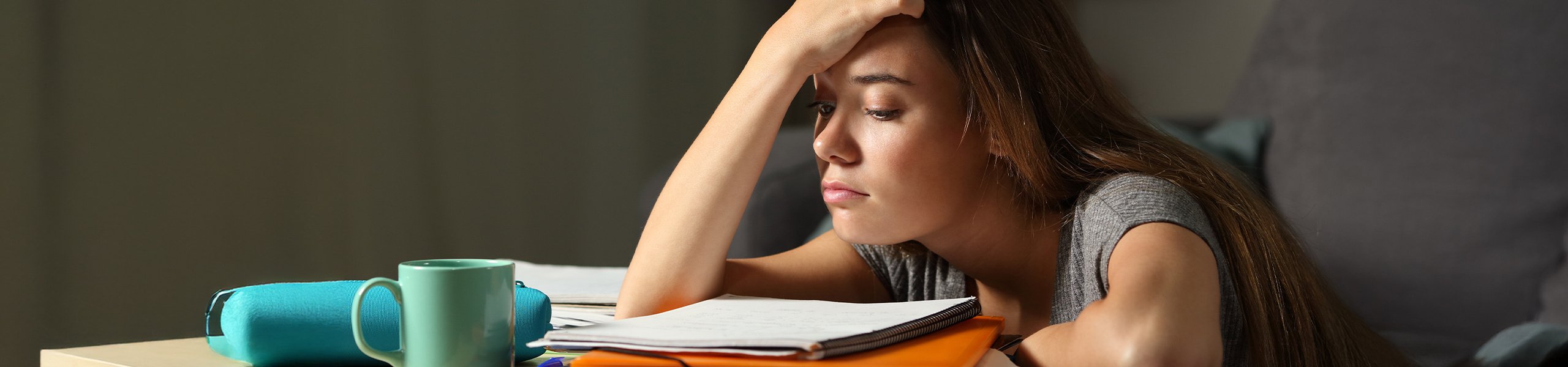 Student with anxiety looking over books