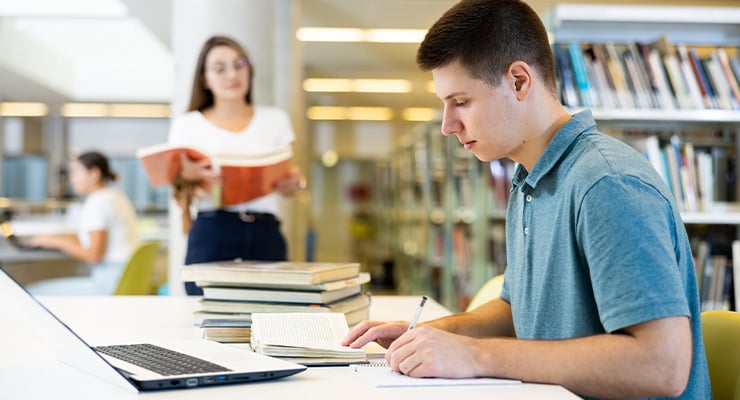 A student studying in a library.