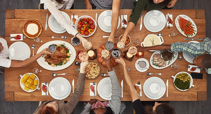 Students having Thanksgiving dinner together.