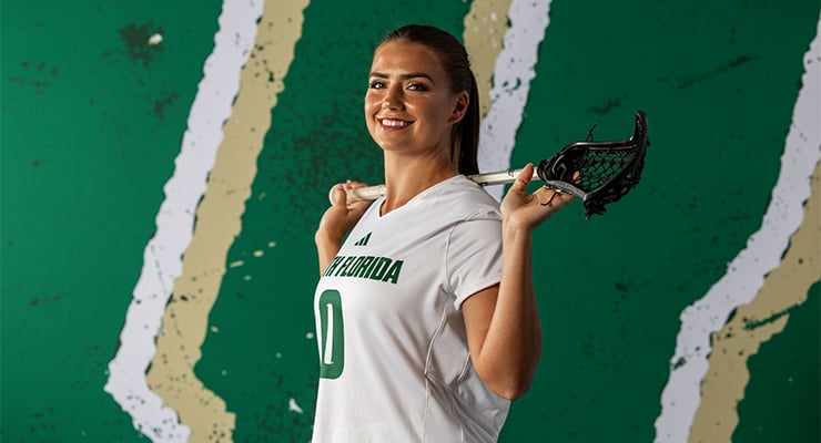 Sofia Chepenik, a USF student athlete, posing with her crosse.