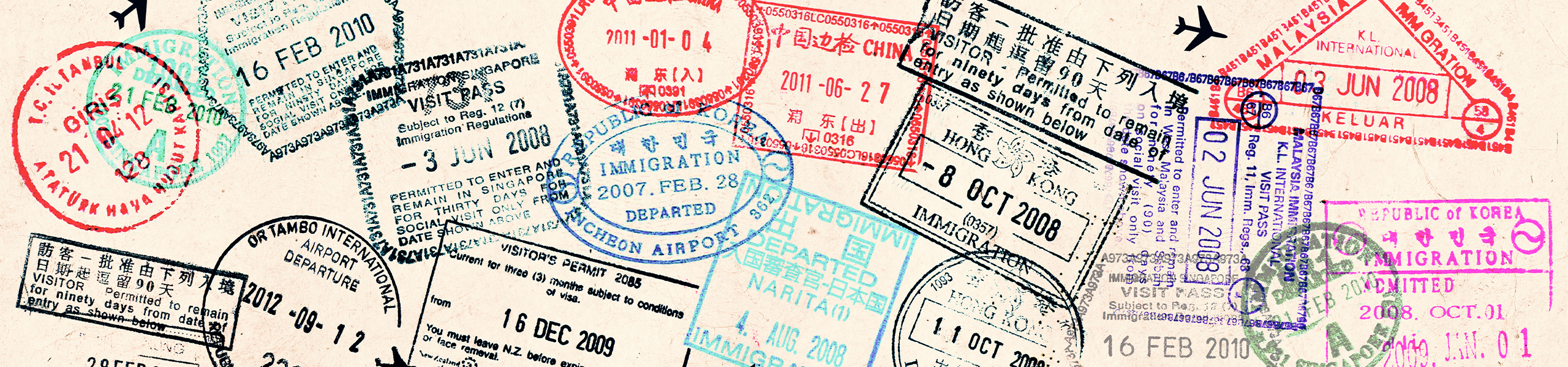 Passport stamps on a page.