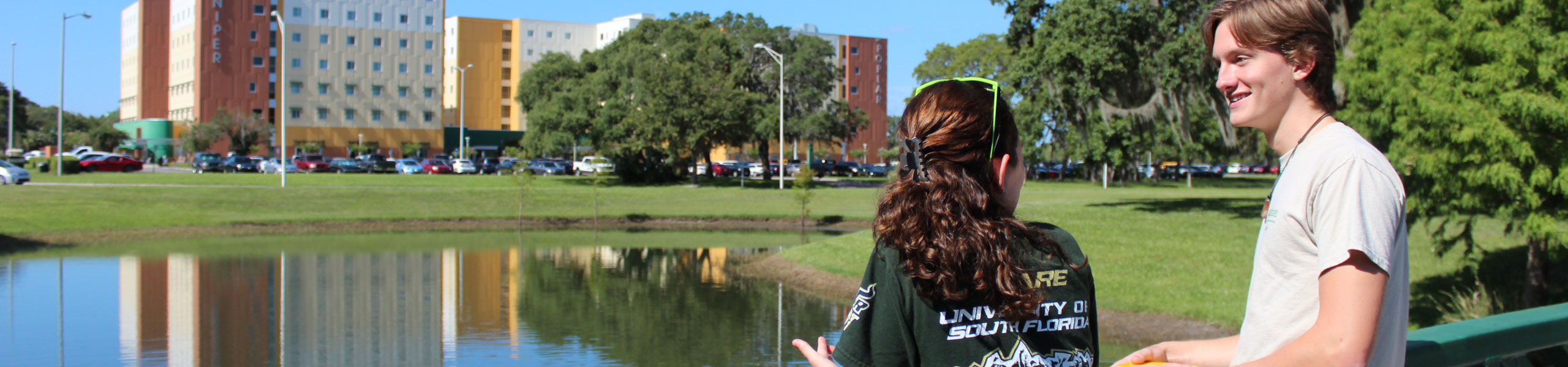 Two USF students talking on campus.