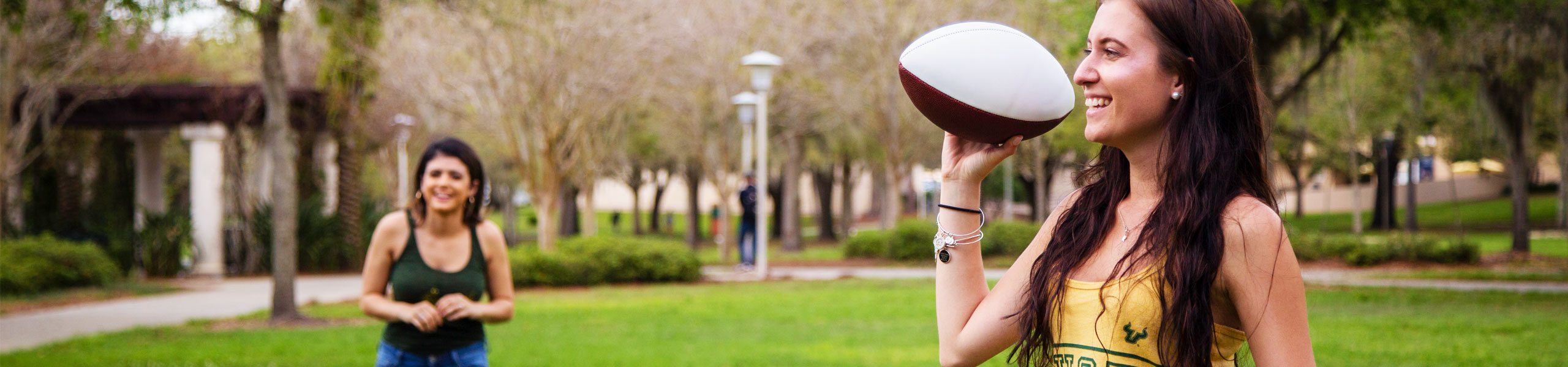 USF students enjoying a day outside playing football.