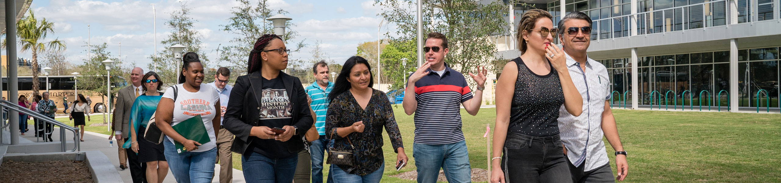 Parents and students walking through USF on a tour