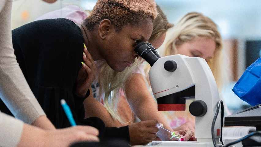  A student using a microscope.