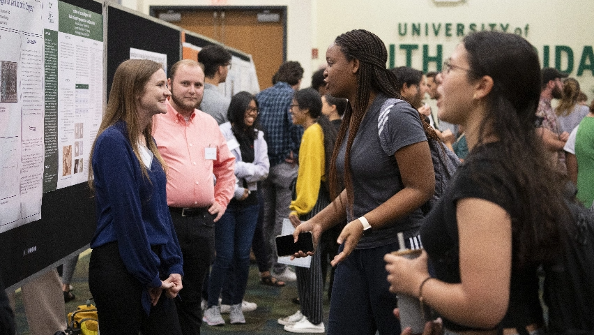 USF students talking to representatives in an event on campus.