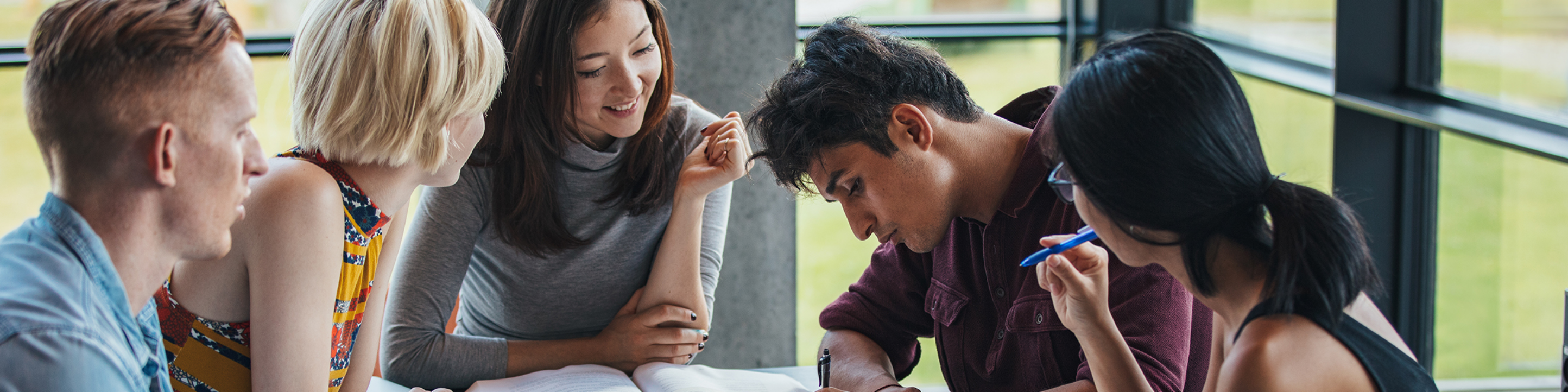 A group of close-knit honors college students studying.