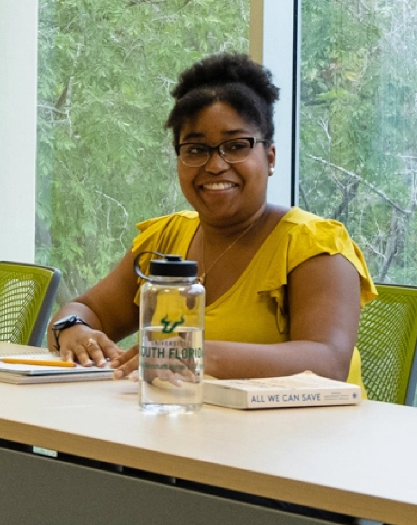 A female student enjoying the new Judy Genshaft Honors College.
            