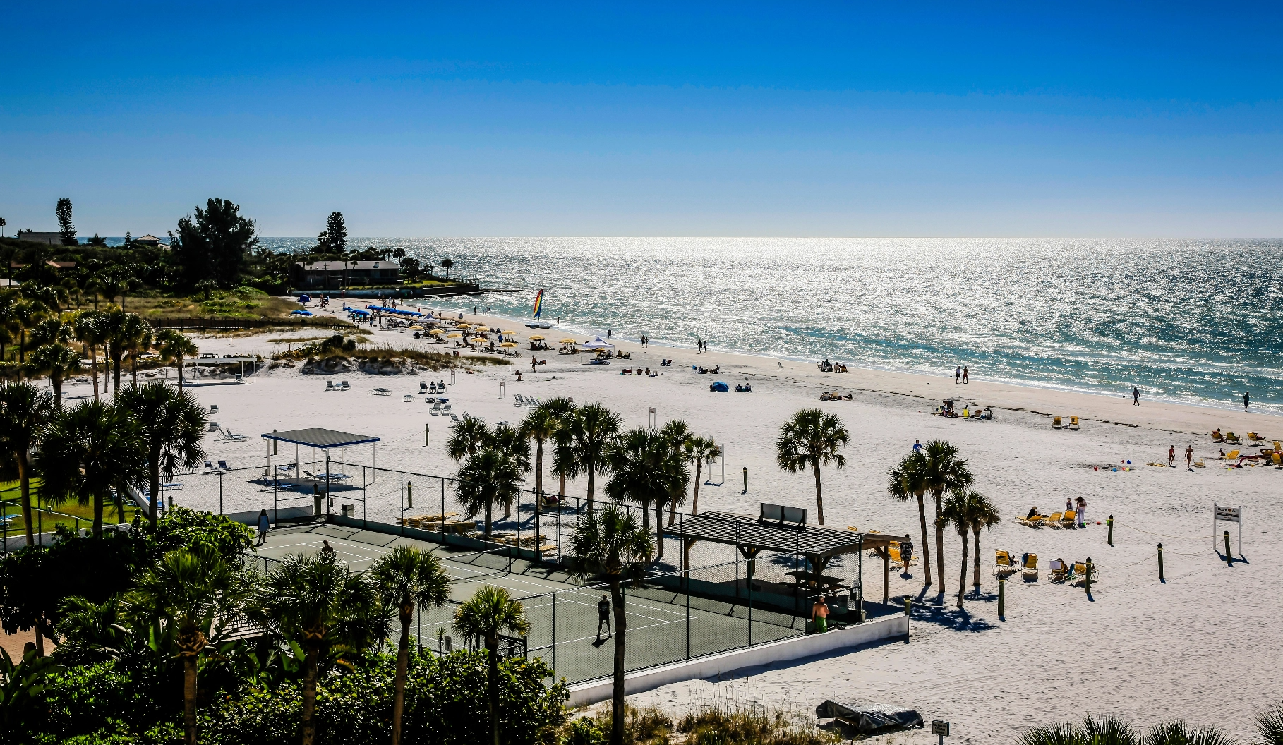 Aerial shot of Siesta Key showcasing the beach and tennis courts.
