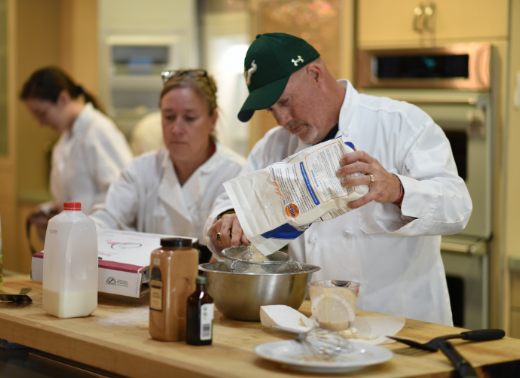 Campus dining professionals preparing food to be served to students at a USf Sarasota-Manatee dining hall.