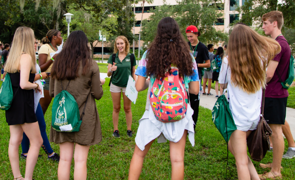 USF students standing together at Orientation interested in campus athletics.
